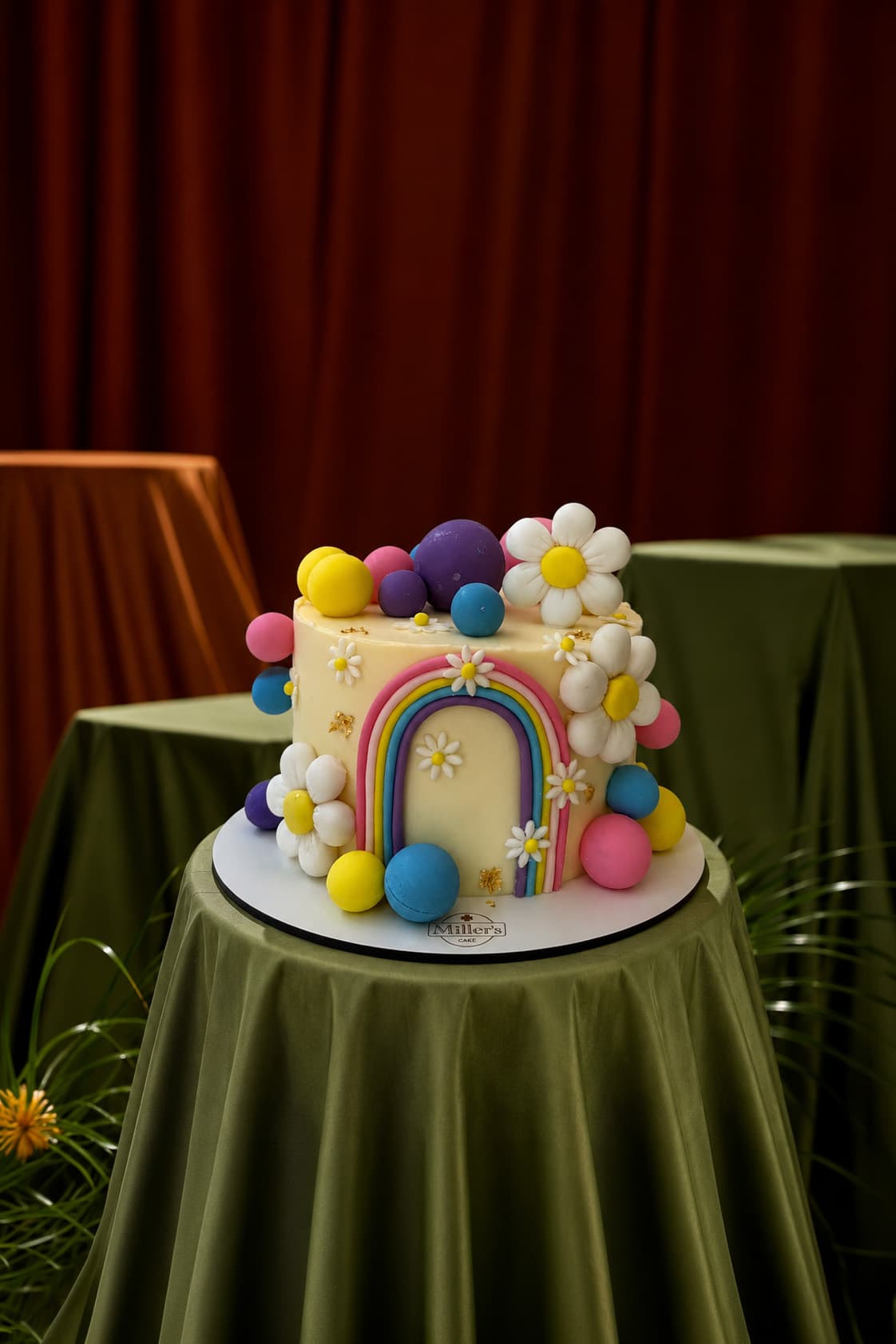Colorful Rainbow and Daisy Celebration Cake